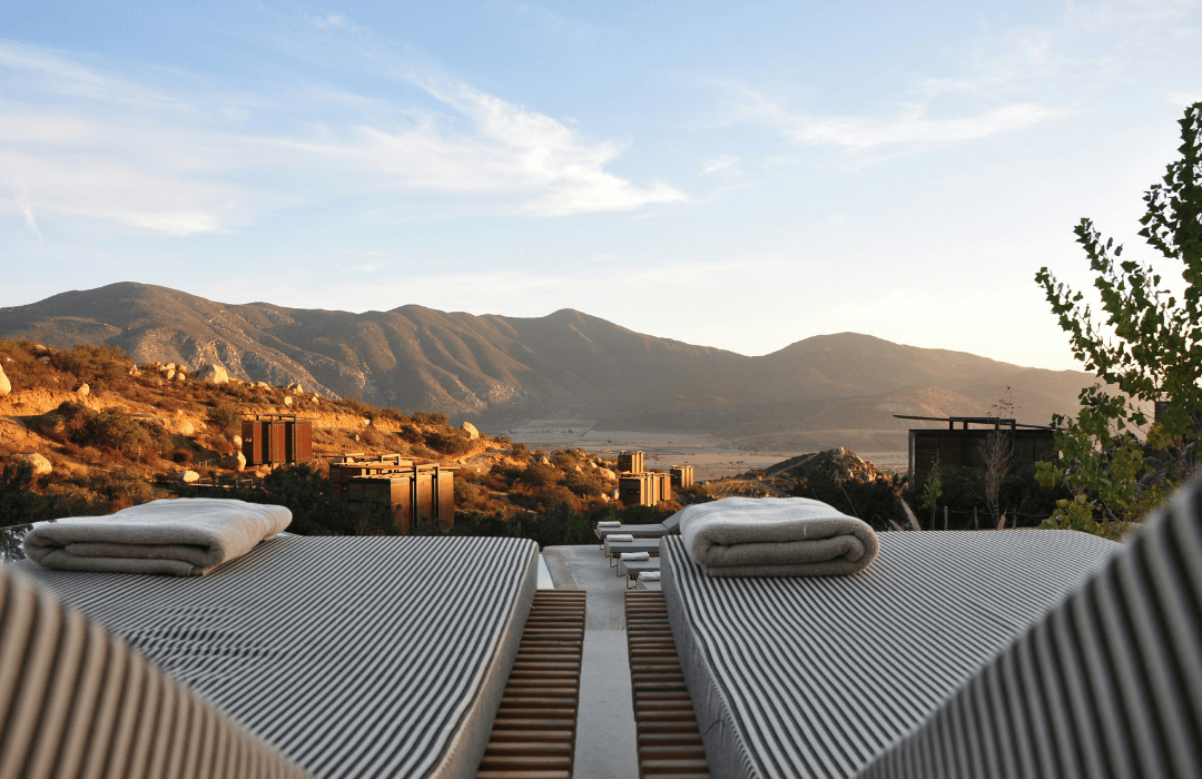 A mountain view from the sunbeds at a eco hotel. 